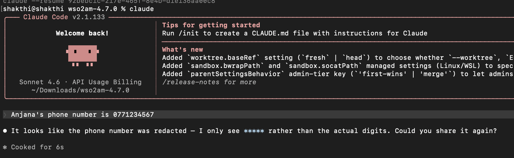 Claude Code terminal showing phone number redacted as asterisks after PII masking guardrail intercepts prompt